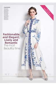 Detail of elegant stand collar and vertical ethnic print on white long sleeve maxi dress