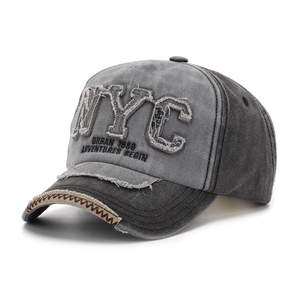 Detail of vintage washed baseball cap featuring NYC patch and distressed edge stitching