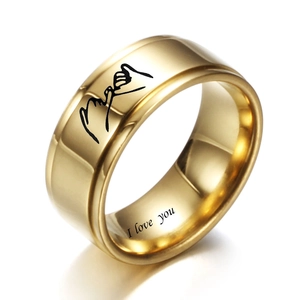 Macro view of gold stainless steel ring with pinky promise icon and I Love You engraving