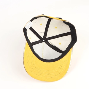 Internal view of punk flat brim hat showing 100% acrylic material label and stitching