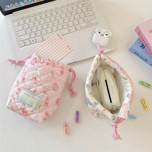 Detailed view of floral quilted cotton drawstring pouches for compact cameras
