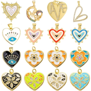 Various heart shaped gold pendants with colorful enamel and zircon inlay designs