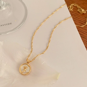 French vintage gold plated necklace featuring a 3D rose flower relief coin pendant