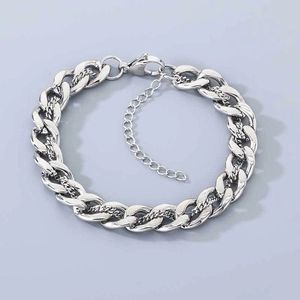 Detailed macro view of the silver cuban link chain bracelet with lobster clasp and extender