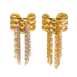 Elegant tiered gold metal earrings with silver tassel chains and white pearls on white background