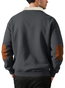 Detail of dark grey pullover hoodie with brown leather elbow patches and fleece collar
