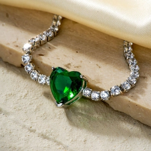 Elegant heart-shaped emerald green zircon necklace on a sparkling silver tennis chain