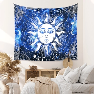 Detail of sun and moon tapestry displayed as a bohemian wall hanging in a cozy bedroom