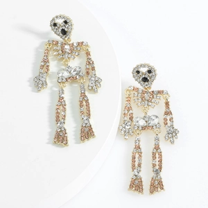 Sparkling crystal skull earrings with rhinestones in gothic style on white background