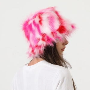 Detail view of pink and white tie-dye plush faux fur bucket hat with soft texture