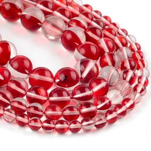 Macro detail of red and clear translucent round beads with inner striped texture