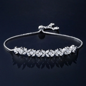 Detailed view of silver flower bracelet with marquise cubic zirconia and adjustable slide clasp