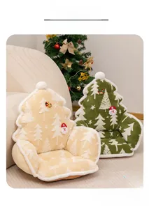 Detail of plush Christmas tree cushions with 3D Santa decor and soft pom-poms