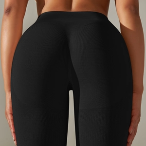 Detail view of seamless high waist yoga leggings with scrunch butt lift texture in black
