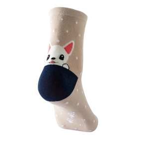 Detail of light brown cotton socks with white polka dots and cute dog cartoon pattern