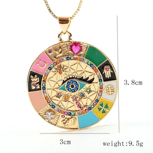 Detail view of gold charm pendant showing size 3.8cm by 3cm and weight 9.5g dimensions