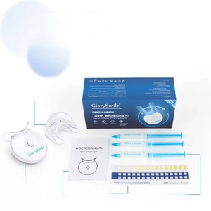Complete teeth whitening kit with LED light, mouth tray, and professional whitening gels