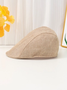 Close-up of light brown woven linen fabric texture on a breathable flat cap