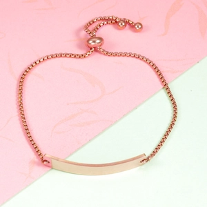 Macro shot of rose gold bar bracelet featuring an adjustable box chain and mirror finish