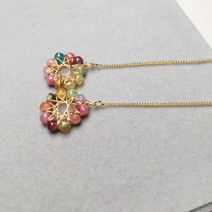 Detail of candy-colored tourmaline earrings with 14K gold-filled wire wrap and long chain
