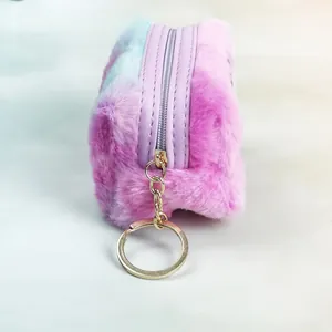 Detail of soft gradient plush coin purse with purple zipper and golden keychain clip