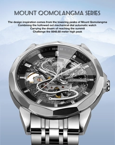 Close-up of skeleton mechanical dial and silver steel strap against snow mountain backdrop