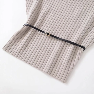Chic grey ribbed knit top featuring a slim black waist belt with gold oval buckle