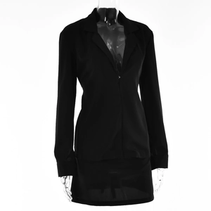 Detailed view of women's black long-sleeve blazer and high-waist mini skirt suit set
