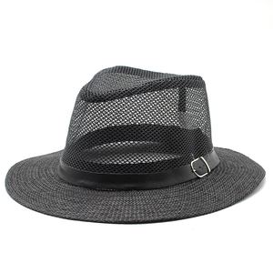 Detail of breathable mesh crown and leather band on a black summer fedora hat for men