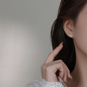 Asymmetric S925 sterling silver planet and moon stud earrings with zircon stones on model