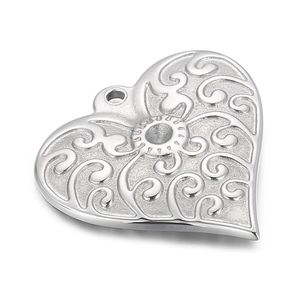 Creative stainless steel heart pendant with intricate floral hollow carvings and sun pattern
