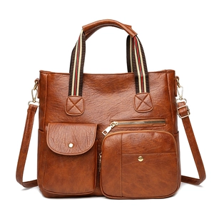 Vintage brown PU leather tote bag with multi-pocket design and striped webbing handles
