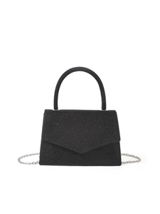 Macro shot of black glitter evening bag with V-shaped flap and metallic chain strap