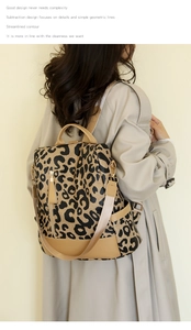 Detail of adjustable straps and leopard print pattern on a stylish PU leather backpack