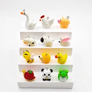 Set of 12 colorful resin animal charms including duck and bear for DIY jewelry making