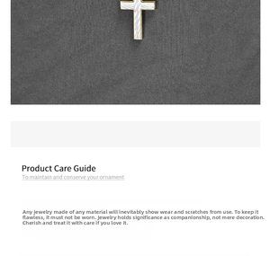Macro detail of cross pendant showing gold polished edges and silver brushed texture
