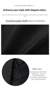 Detail of black oil wax leather texture and reinforced stitching on travel backpack