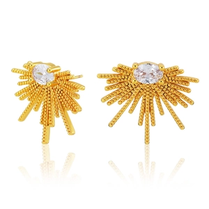 Golden sunburst stud earrings with oval zircon center on a reflective white surface