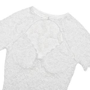 Detail of white lace bodysuit showing floral texture and metal clasp at neckline