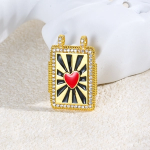 Detail of gold rectangular heart pendant with black enamel and clear stones for DIY jewelry