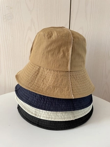 Detailed stack of quick-dry nylon sun hats in khaki, navy, beige and black colors