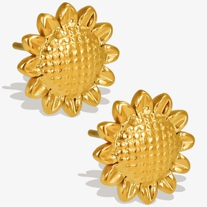 Macro detail of sunflower studs in 18k gold plated stainless steel with petal textures