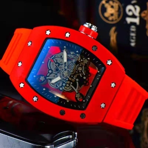 Macro shot of red silicone strap and skeleton dial on tonneau shaped luxury watch