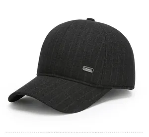 Close-up of middle-aged men's wool baseball cap with striped texture and metal logo