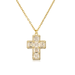 Detailed view of a gold cross necklace with micro-set clear cubic zirconia crystals