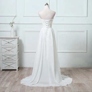 Elegant strapless white wedding dress with lace bodice and back lace-up detail