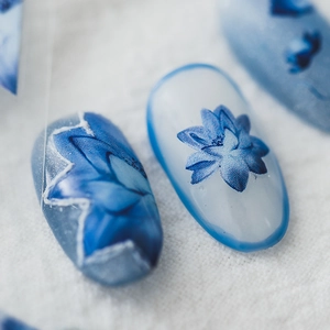 Blue and white floral nail stickers with delicate lotus design and frosted texture
