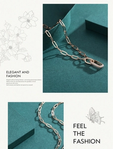 Macro detail of a rose gold S925 sterling silver necklace with interlocking crystal pendants