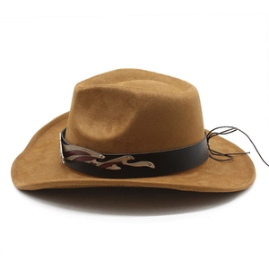 Detail of western cowboy hat with brown suede texture and decorative metal buckle band