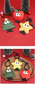 Detail of Christmas tree and apple PU leather charms with festive holiday ornaments